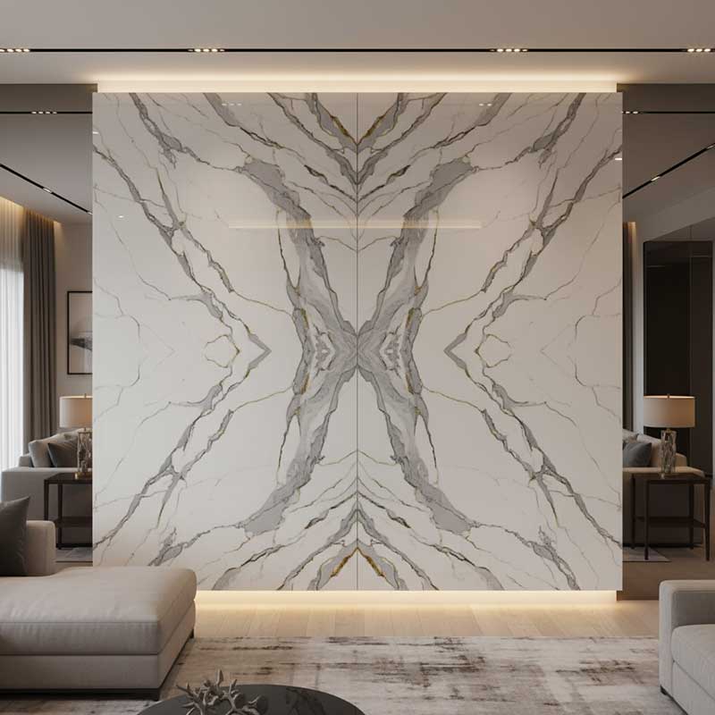Bookmatched engineered quartz wall installation with perfectly symmetrical Calacatta marble grey and gold veining pattern creating a butterfly effect