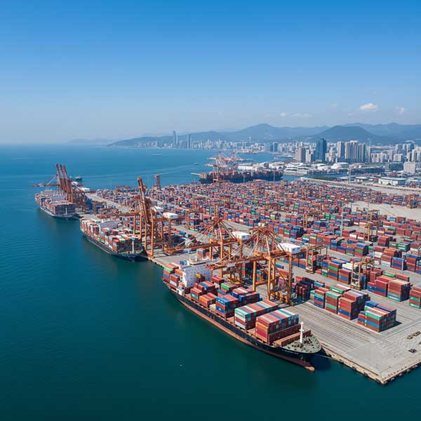 Aerial view of container ships at international port representing global quartz stone export trade routes and logistics