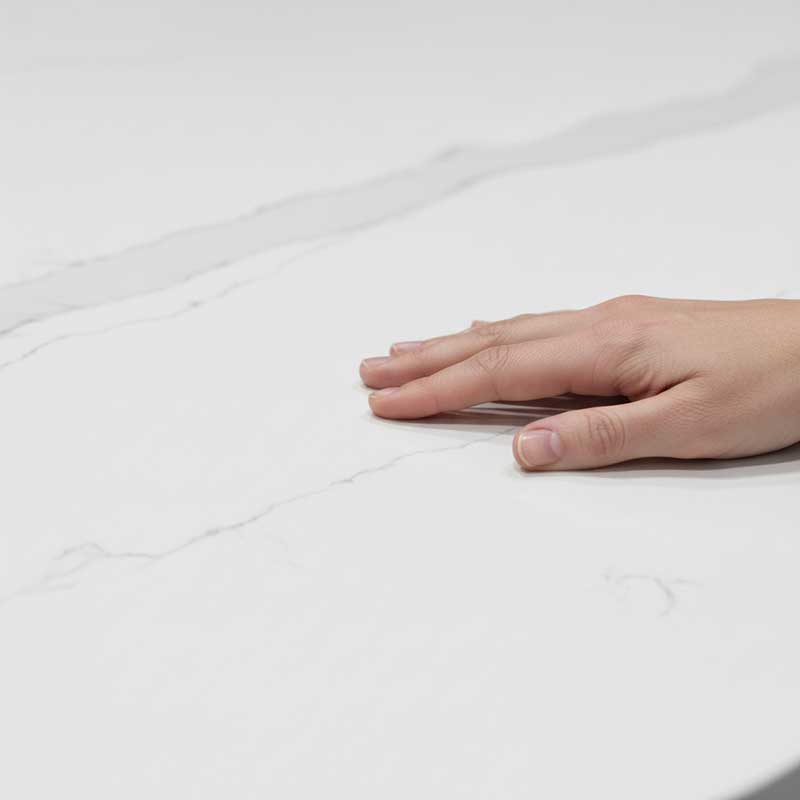 Close-up macro photograph of honed matte finish quartz surface showing smooth texture with subtle veining pattern