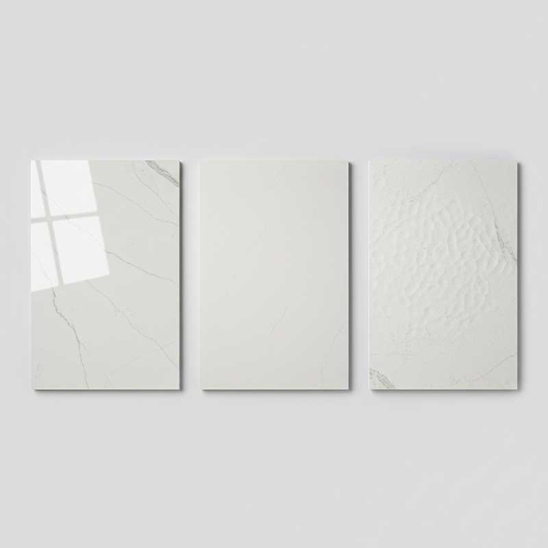 Side-by-side comparison of three engineered quartz surface finishes on white marble-look panels showing polished glossy, honed smooth matte, and leathered textured surfaces