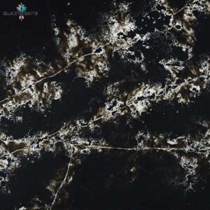 High-contrast dark engineered quartz surface showing dynamic white veining resembling a galaxy pattern